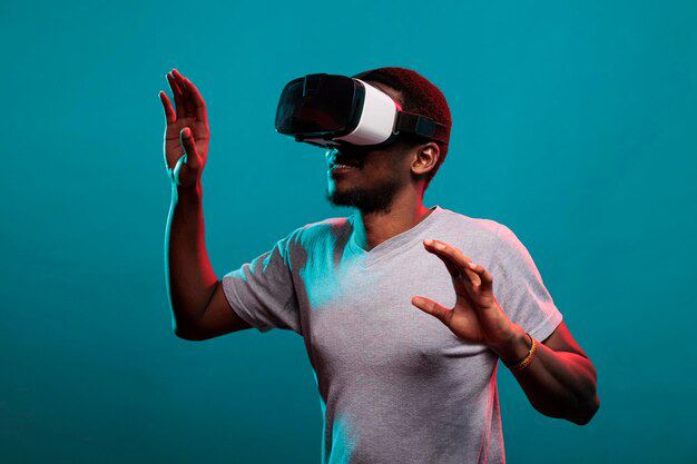 man gesturing wearing virtual reality headset against colored background 1048944 93062381645214427778334819